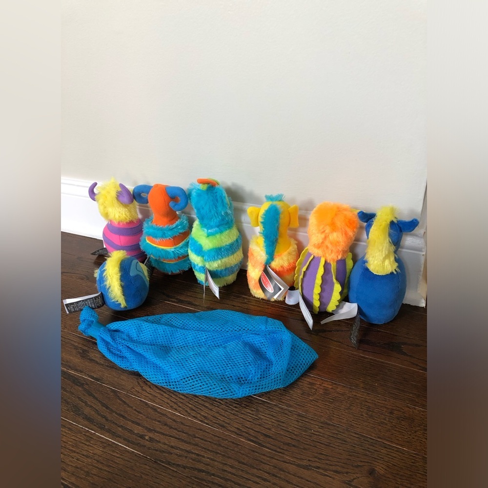 Melissa & Doug 8-Piece Fuzzy Monster Bowling Pin and Ball Set w/Mesh Storage Bag - Picture 4 of 6